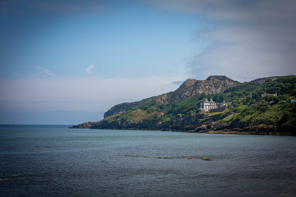 A picture of sea and land on a summers day